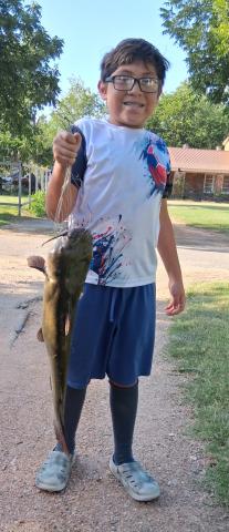 Maui Jimenez, age 11, went fishing at Bend and caught a 10 lb channel cat using a rod &amp; reel and night crawlers for bait. Maui said, 'This is my first big fish ever!' Courtesy of Javier Jimenez