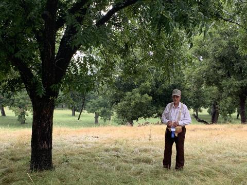 Jackie Brister is standing in this beautiful pecan orchard holding his 1st Place award. Courtesy of Gennifer Brister