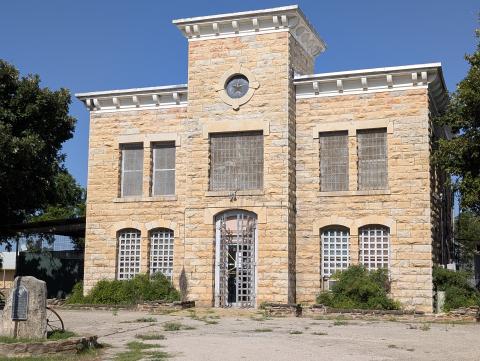 This photo of the San Saba County Jail, with caution tape across the gate, was taken on Tuesday, July 21, 2026. You can also see the Historical Marker in the lower left of the photo. Photo by Yvonne Contreras