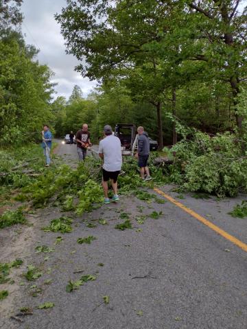 Dave Hopson and neighbors clearing the road (In Canada during Sue Ransom’s trip) Photo by Dee Hopson