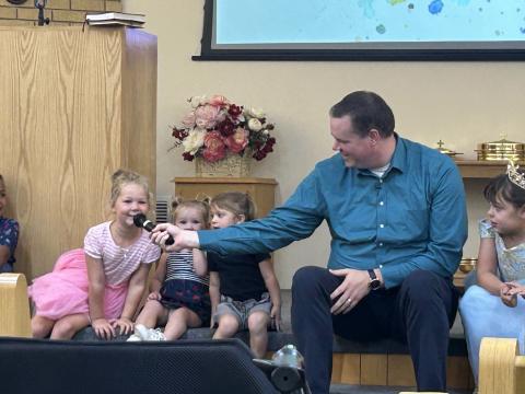 Minister of Bertram Church of Christ Mason Pucket asking the little ones what they want to be when they grow up during a Children’s Moment