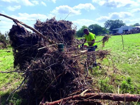 Yes, there is a fence in there! Volunteers from Max Services in DeQuincy, Louisiana, came to help in San Saba after the flooding. Courtesy of Max Services