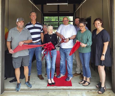 'goodtogo.dev' had their Ribbon Cutting Ceremony Monday, May 20th, at the Visitor's Center. Pictured left to right: Larry Davis, James Hellums, Shelia Meador, Zahra Allibhai, Jason Phillips, Robby Johnson, Angela Johnson, and Chamber of Commerce Director Paige Faught. Photo by Djuana Payton