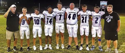 Coach Ethridge, #5 Trendon Vogel, #10 Matthew Woerndell, #14 Ian McKinnerney, #7 Eli Hutchins, #40 Hunter Stewart, #21 Christian Greenwood, #2 Christian McKinnerney, and Coach Watkins Courtesy of Richland Springs Coyote Booster Club