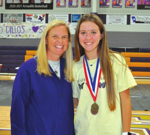 Coach Nicole Walts with Madison Shahan. Maddie is the DISTRICT CHAMPION in Number Sense and BRONZE MEDALIST in Mathematics.