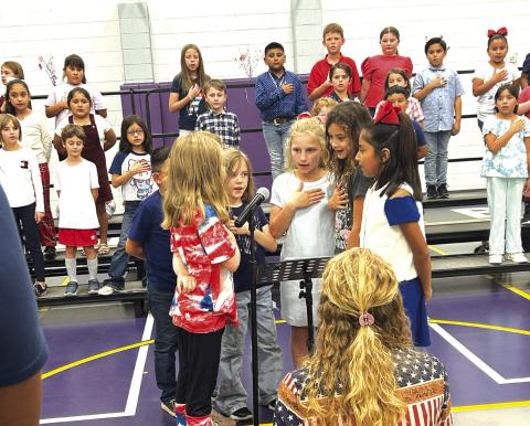 Jasmine Vanderburg, Allison Millican, Anlee Boswell, Hadley Fuller, Addilyn Morrison, and Abigail Davila singing the National Anthem