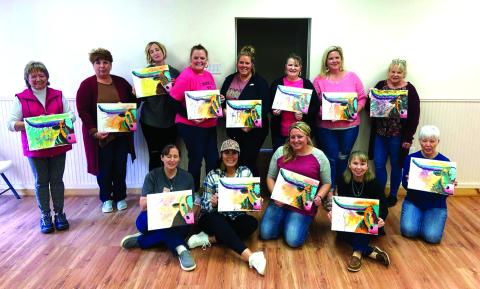 Teachers, retirees, and friends sharing their big smiles and their painting masterpieces!
