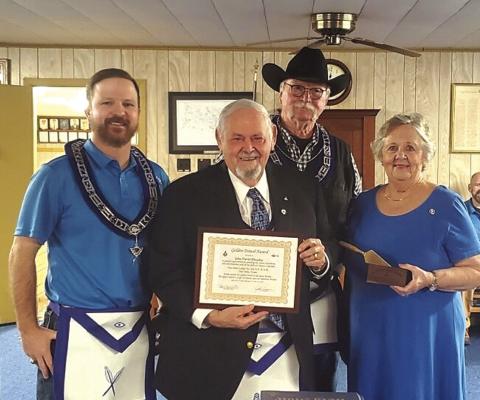 Last Saturday, John “Dusty” Rhoades, a longtime member of San Saba Lodge #612, was presented with the “Golden Trowel Award.” The Golden Trowel Award is the highest honor a brother can receive in his lodge. Left to right: Jake Lackey (Secretary), John Rhoades, Les Hammett (Worshipful Master), and Mary Dell Rhoades