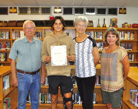 Pictured are Rotarians Jerry Blankenship, Beth Griess, and Jacqueline Carlson along with Jaxzen Mask, Rotary October Student of the Month.