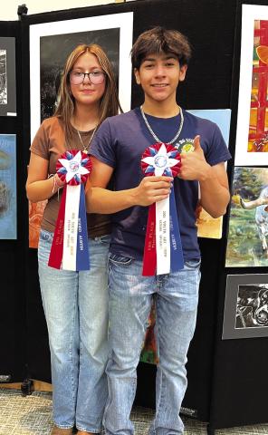 Saraih Plata and Angel Reyes had their art pieces selected for the silent auction at the Rodeo Austin Youth Art Show last Friday. See the story on the Back Page - SSHS Art Students shine at Rodeo Austin Youth Art Show. Courtesy of Shara Wright