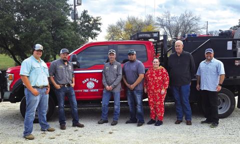 These are the 'delivery trucks' and volunteers ready to deliver the Angel Tree gifts. Courtesy of Corina Fauley