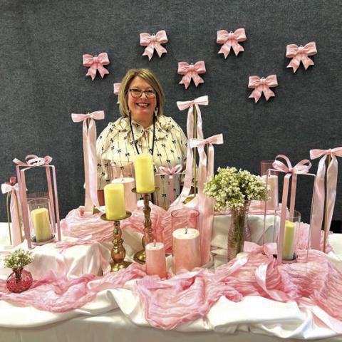 Kaci Morrison is the coordinator of the ladies day event, and this was her 10th year doing it. This beautifully decorated table is the first thing you would see as you entered the room. You should have seen the rest of the gym. They did a fabulous job! Ladies, get ready for next year! Courtesy of Cherokee Home for Children