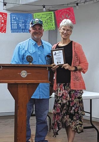 Newly installed President Buck Gilcrease thanks Outgoing President Beth Gilcrease for her service.