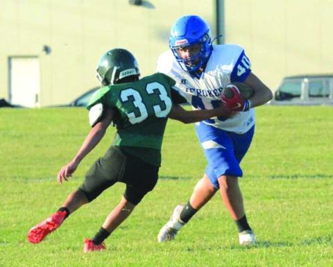 Cherokee's Uriah Valdez is protecting the ball on Thursday night, September 15th, during the Indians' 84-44 win over Bluff Dale.