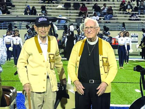 Floyd Miller (left) and Bill Grusendorf, who played for the 1948 Waco High Tigers state championship team, were recognized at halftime of the Waco High-Shoemaker game at Waco ISD Stadium. Photo courtesy of Brice Cherry, Waco Tribune-Herald