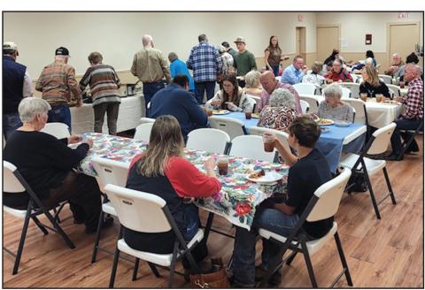 Wonderful food and great fellowship at community luncheon. Photo by Paige Moats