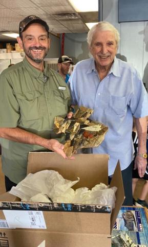 Wayne Gatliff is presenting Jeff Crews of Petty's Steaks and Catfish a gift of appreciation.