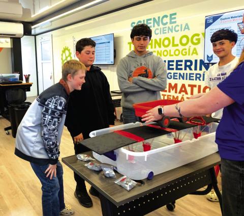 Connor Greenwood, Jaxon Fleming, Edgar Flores, and Andrew Woerndel as they prepare to test their bridge. Photo by Sue Ransom