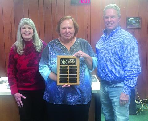 Kim Wilson pictured here proudly holding her much deserved Employee of the Month plaque. Participating in the presention was City Treasurer Charlene Lindsay and Alderman Marcus Amthor. Congratulations, Kim! Photo by Scott Glaze