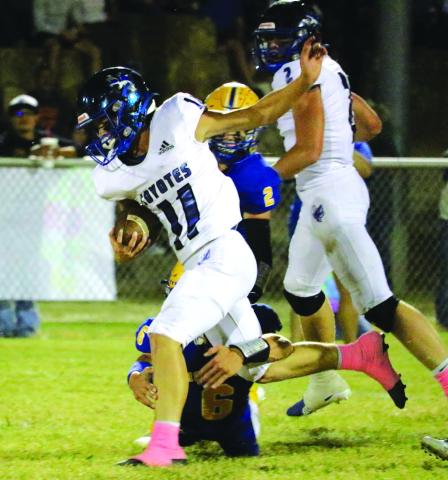 #11 Kenny Triplett carries the ball toward the goal as #2 Keston Lusty looks on after play execution. Photo by Pam Starr