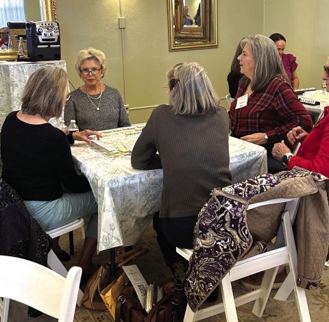 The ladies are having a fun time learning this new game. Courtesy of Donna Baxter