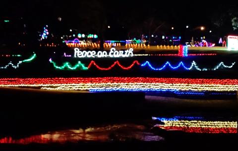 View from East Wallace street shows off the beautiful light display at Mill Pond Park. Colorful lights including their reflection as the water flows from Mill Pond park and makes its way to the Colorado River and the lights surroung Mill Pond are quite a site to see.
