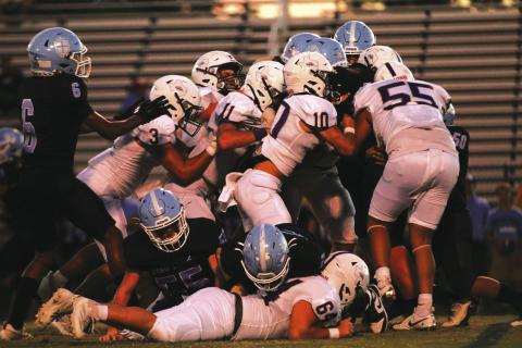 Armadillos make a team tackle to stop the Cougars in last week’s win Photos courtesy of Kayti Lackey - 1916 Athletics