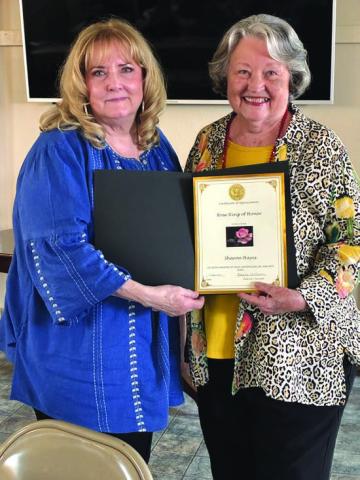 Marjean Alexander honors Sharon Hayes for serving 50 years in the San Saba Garden Club. Courtesy of Debbie Shahan