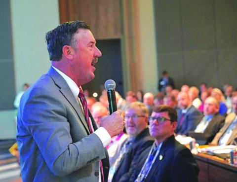 Texas Farm Bureau President Russell Boening addresses the voting delegates during the American Farm Bureau Federation's annual convention and business meeting.