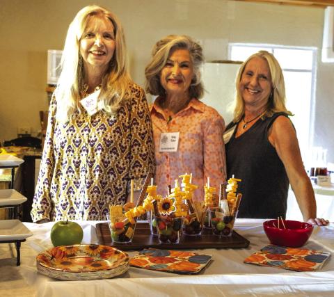 Photo of hostesses (l-r): Denise Mayfield, Betty Jo Fisher, Mona McMahan (chair) Photo courtesy of Karen Sloan