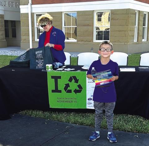 Mateo Martinez with his recycling educational coloring book