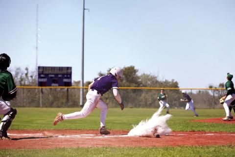 #1 Luke Tharp hits a single to center field in last week’s loss against Harper.