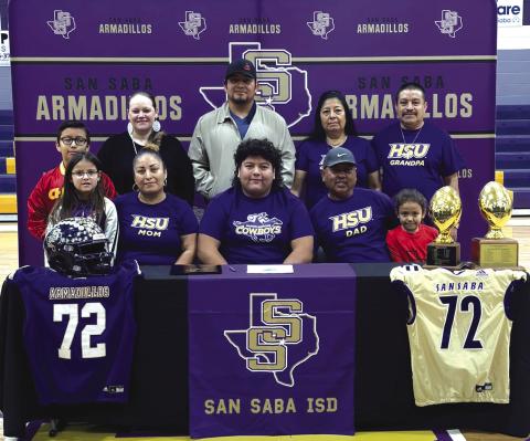 Cristian Ramirez surrounded by his family