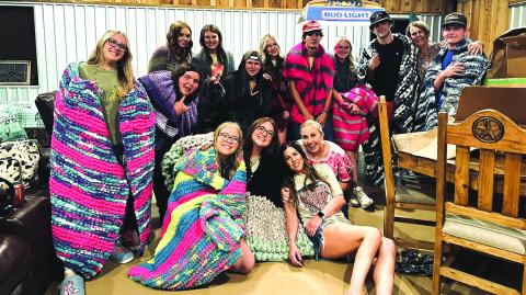Seniors displaying the blankets they made as a senior project to reflect their personalities. Miss Starr completed seven of the twelve. Back row (l-r):  Kenzie Gossett, Savannah Garcia, Mackenzie Schuessler, Ryleigh Bryant, Kenny Triplett, Lili Appleton, Jayden Sutherland, Reagan Wright, Troy Shelton, Mrs. Pam Starr, Josh Usury Front, Jaylen Ethridge Maddie Bailey, Mrs. Sarah Locker, and Miss Jessica Starr. Photo by Foster Locker