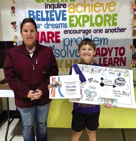 Asher Little, a second grader at San Saba Elementary, earned first place in the San Saba Soil and Water Conservation District’s annual poster contest. This year’s theme was “Soil: Where It All Begins.” Pictured with Asher is Carol Gibson, representing the San Saba Soil and Water Conservation District. Courtesy of Kallie Bush