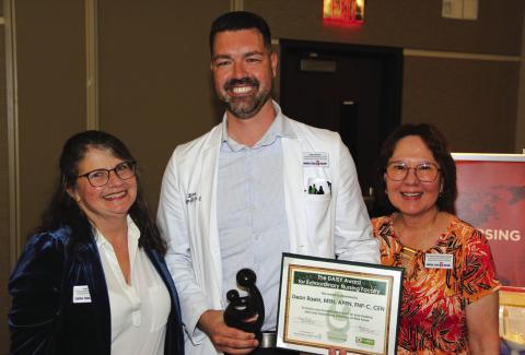 Central Texas College nursing professor Dean Raein (center) was chosen this year’s faculty DAISY award winner based on nominations from students in the Associate Degree in Nursing program. Raein received a certificate and the hand-carved sculpture award from co-workers Lori Forsyth (left), professor and assistant department chair – Department of Health Sciences, and Susan Ramnarine-Singh, professor and director - Nursing Programs.