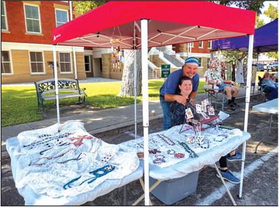 Mason and Mary Zeigler were showing off their smiles and homemade jewelry at Pecan Capital Trade Days last Saturday.