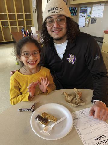 Families read and followed directions to make s’mores together. Then using their five senses, they described how the s’more smelled, tasted, felt, sounded, and looked. Each kindergartner got to choose 5 little readers to take home to read with their family. It was a fun night! Yedid Rodriguez and Leonel Aranda