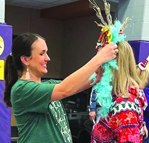 Mrs. Kallie Bush, last year’s Turkey Queen winner, crowned Mrs. Alyssa Oliver, Kindergarten Reading Language Arts teacher, the “Dry Bone Award” for the least amount of points.