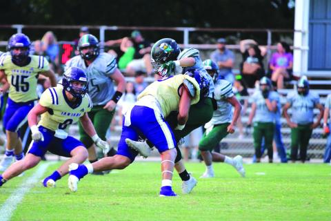 Adrian Martinez puts a big hit on a Grape Creek player / Courtesy of Kayti Lackey- 1916 Athletics