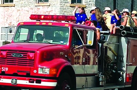 San Saba Armadillos riding on a SSVFD truck ~ San Saba Rodeo Parade Courtesy of Carolyn Preece
