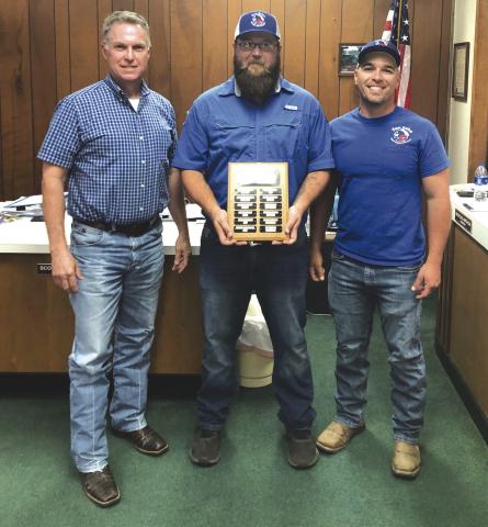 Cody Mann - Employee of the Month (center) with Alderman Marcus Amthor to his right and his supervisor, Jesse Hunt, to his left. Photo by Scott Glaze