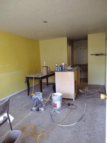 Condition of room on the evening of October 3, 2024. Work had already begun. Walls and ceiling had been repaired and were waiting to be painted. Carpet had been removed, and new carpet was being ordered.