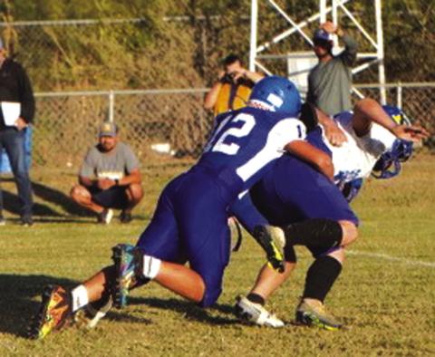 Cherokee Jr High’s #12 Brady Palermo with a big defensive tackle of the Hornets Photo courtesy of Valerie Valdez