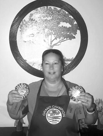 PLEASE NOTE – This is a name correction to the photo cutline received from Howlers Club staff: Grand Champion - Elissa Gilmore –Baking - Cake Division &amp; Other Division at the Richland Springs Stars &amp; Stripes Celebration in July.