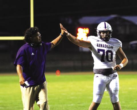 Coach Aguirre gives Layke Haynes some love.  Photos courtesy of Kaytie Lackey - 1916 Athletics