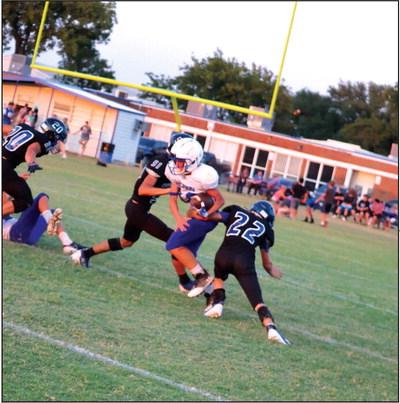 Richland Springs Defense in action - #22 Clayton Meador, #51 Jim Eckermann, and #20 Gage Behrens Courtesy of Pam Starr