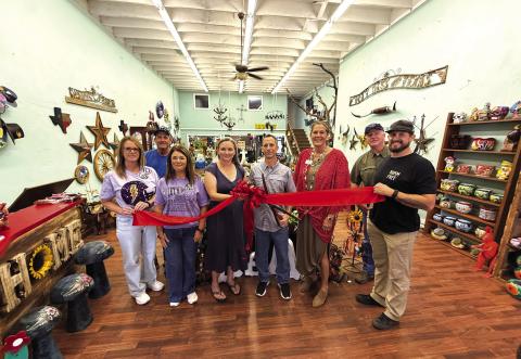 Mustard. Seed. Hobbies. holds ribbon cutting