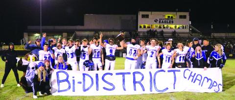 Richland Springs Coyotes proudly holding the Bi-District Champs banner Photo by Pam Starr