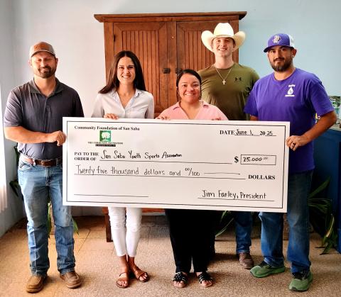 The Community Foundation of San Saba County Inc. donated $25,000 to the San Saba Youth Sports Association. Pictured holding the check (L-R): Aaron Johnson, Margaret Henslee, Rosie Huff, and board members Holt Oliver and Sean Smith. Not pictured: Fantasia Hoyt, Amanda Rivera, and Jim Farley (Board President). Photo by Djuana Payton